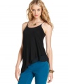 Sleek and chic - DKNY Jeans' asymmetrical tank top is a breezy essential for day or night. Create an on-trend ensemble when you pair it with colored jeans.