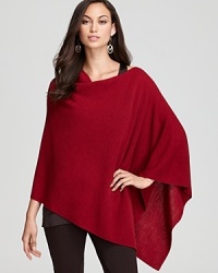 Embrace a bohemian sense of style in an effortless Eileen Fisher poncho rendered in luxe merino wool. Embrace a bohemian sense of style in an effortless Eileen Fisher poncho rendered in luxe merino wool.