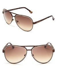 MICHAEL Michael Kors takes these aviators to two glamorous extremes-matte or shiny-and adds a signature touch with logo screw details. MICHAEL Michael Kors takes these aviators to two glamorous extremes-matte or shiny-and adds a signature touch with logo screw details.