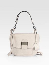 A trim, tailored shoulder style in tumbled leather with a front flap and a bold tab strap.Detachable top handle, 7 drop Detachable, adjustable shoulder strap, 24 drop Magnetic snap flap close Front open pocket under flap Back double open pockets One inside zip pocket One inside open pocket Cotton lining 9W X 7½H X 3D Imported A trim, tailored shoulder style in tumbled leather with a front flap and a bold tab strap.Detachable top handle, 7 drop Detachable, adjustable shoulder strap, 24 drop Magnetic snap flap close Front open pocket under flap Back double open pockets One inside zip pocket One inside open pocket Cotton lining 9W X 7½H X 3D Imported
