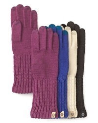 Keep cozy all winter long with UGG® Australia's knit gloves, featuring touch-screen compatible fingertips. Keep cozy all winter long with UGG® Australia's knit gloves, featuring touch-screen compatible fingertips.