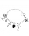 Charmingly chic. GUESS' multi charm bracelet features heart, disc, cross, medallion and key emblems. Embellished with glittering glass and epoxy accents as well as plastic pearls, it's set in silver tone mixed metal. Approximate length: 7-1/2 inches.