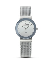 Classic elegance, watch features a slim stainless steel case with a mirror border, light blue dial, and Skagen's signature mesh band. Classic elegance, watch features a slim stainless steel case with a mirror border, light blue dial, and Skagen's signature mesh band.