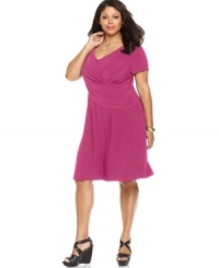 Look slender and sensational with Elementz' short sleeve plus size dress, featuring a flattering crisscross front and slimming panel-- wear it from day to play! Look slender and sensational with Elementz' short sleeve plus size dress, featuring a flattering crisscross front and slimming panel-- wear it from day to play!