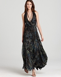 This Halston Heritage halter gown channels bohemian glamour with an eclectic print and sweeping length.