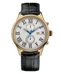 For the dashing gentleman. Handsome watch by Tommy Hilfiger crafted of black croc-embossed leather strap and round gold ion-plated stainless steel case. Textured silver tone dial features applied black Roman numerals, date window and logo at three o'clock, two multifunctional subdials and three blue hands. Quartz movement. Water resistant to 30 meters. Ten-year limited warranty. For the dashing gentleman. Handsome watch by Tommy Hilfiger crafted of black croc-embossed leather strap and round gold ion-plated stainless steel case. Textured silver tone dial features applied black Roman numerals, date window and logo at three o'clock, two multifunctional subdials and three blue hands. Quartz movement. Water resistant to 30 meters. Ten-year limited warranty.
