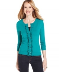 With a ruffled placket and rhinestone buttons, this cardigan from Top Knits is a feminine classic!