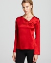 Ravishing in red, this Armani Collezioni stretch silk blouse flaunts twisted detail at the neckline for a unique element that's not to be missed.