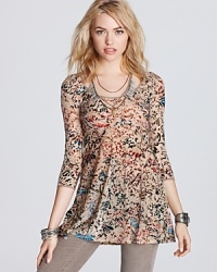 A touch of luxe adorns this Free People tee in the form of an elegant velvet burnout pattern, complete with a flared hem for a flattering fit. A touch of luxe adorns this Free People tee in the form of an elegant velvet burnout pattern, complete with a flared hem for a flattering fit.