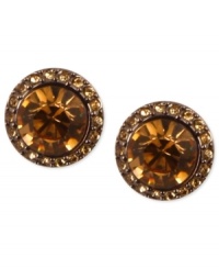 Smoky sophistication stands out on Givenchy's stud earrings. A light Colorado topaz glass stone is surrounded by pave accents. Crafted in brown gold tone mixed metal. Approximate diameter: 1-1/2 inches.