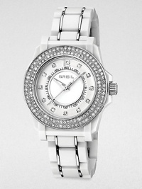 Rows of shimmering Swarovski crystals and an ultra-light white link bracelet create a timeless contrast of tradition and tech.Quartz movementWater resistant to 10 ATMStainless steel round case with white polycarbonate finish, 35mm diameter (1.38)Crystal bezelWhite dialArabic numeral 12 and crystal hour markersSecond handLightweight white polycarbonate link bracelet with stainless steel accentsImported Rows of shimmering Swarovski crystals and an ultra-light white link bracelet create a timeless contrast of tradition and tech.Quartz movementWater resistant to 10 ATMStainless steel round case with white polycarbonate finish, 35mm diameter (1.38)Crystal bezelWhite dialArabic numeral 12 and crystal hour markersSecond handLightweight white polycarbonate link bracelet with stainless steel accentsImported