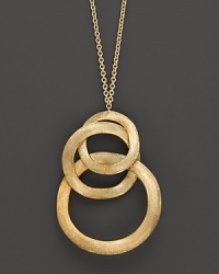 Three beaten discs of 18K yellow gold interlock with a striking effect. From the Marco Bicego Jaipur collection. Three beaten discs of 18K yellow gold interlock with a striking effect. From the Marco Bicego Jaipur collection.