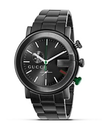 A black bracelet watch from the Gucci G Chrono collection. Round black guilloché G dial in black casing. Stick hour indices, green sweep second hand. Triple blade deployment buckle. A black bracelet watch from the Gucci G Chrono collection. Round black guilloché G dial in black casing. Stick hour indices, green sweep second hand. Triple blade deployment buckle.