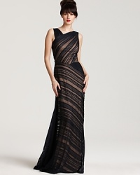 Elegant contrast pleating makes a stunning style statement in this asymmetric evening gown from Tadashi Shoji. This inimitable look promises all eyes will be on you. Elegant contrast pleating makes a stunning style statement in this asymmetric evening gown from Tadashi Shoji. This inimitable look promises all eyes will be on you.