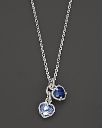 A twin heart necklace in blue quartz and blue corundum framed in sterling silver. Designed by Judith Ripka. A twin heart necklace in blue quartz and blue corundum framed in sterling silver. Designed by Judith Ripka.