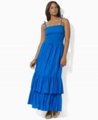 Rendered in airy cotton voile for a full, floaty silhouette, Lauren by Ralph Lauren's graceful plus size maxi dress is designed with a flattering smocked bodice and a two-tiered ruffled hem for whimsical appeal. Rendered in airy cotton voile for a full, floaty silhouette, Lauren by Ralph Lauren's graceful plus size maxi dress is designed with a flattering smocked bodice and a two-tiered ruffled hem for whimsical appeal.