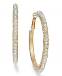 Loop these hoops into your rotation. These c.A.K.e. by Ali Khan earrings flaunt faceted glass beads. Crafted in gold tone mixed metal. Approximate diameter: 1-1/4 inches. Loop these hoops into your rotation. These c.A.K.e. by Ali Khan earrings flaunt faceted glass beads. Crafted in gold tone mixed metal. Approximate diameter: 1-1/4 inches.