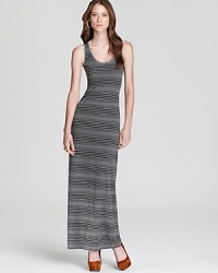 Accentuating your curves while camouflaging your problem areas, the optical illusion of variegated stripes crafts a slimming Three Dot maxi dress. Punctuate the tonal silhouette with acid-bright accents for an on-trend pop of color. Accentuating your curves while camouflaging your problem areas, the optical illusion of variegated stripes crafts a slimming Three Dot maxi dress. Punctuate the tonal silhouette with acid-bright accents for an on-trend pop of color.