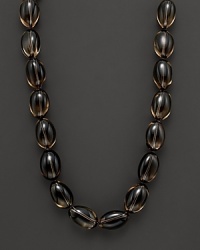 Smoky quartz beaded necklace with gold ball clasp. Smoky quartz beaded necklace with gold ball clasp.