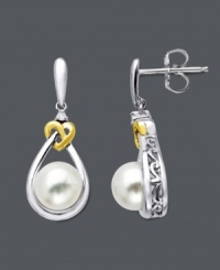 Delight in intricate design. Chic drops feature a cultured freshwater pearl (7 mm) and diamond accents cradled in a sterling silver setting. Twisted heart crafted in 14k gold. Approximate drop: 5/8 inch. Delight in intricate design. Chic drops feature a cultured freshwater pearl (7 mm) and diamond accents cradled in a sterling silver setting. Twisted heart crafted in 14k gold. Approximate drop: 5/8 inch.