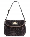 Call of the wild. Tap into the reptilian trend with this snakeskin print purse from Juicy Couture. Soft velour is outfitted with luxe golden hardware and signature detailing, making it the ultimate diva-licious design.