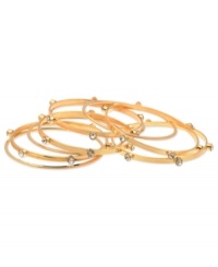 GUESS goes for a minimalist approach with this set of 9 bangle bracelets. Crafted from gold-tone mixed metal, the bangles feature glass stone accents for a stylish complement. Approximate diameter: 2-1/2 inches. GUESS goes for a minimalist approach with this set of 9 bangle bracelets. Crafted from gold-tone mixed metal, the bangles feature glass stone accents for a stylish complement. Approximate diameter: 2-1/2 inches.