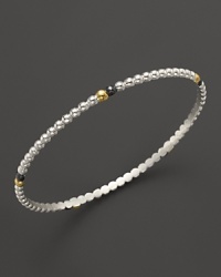 Single 24K gold and dark silver details lend intrigue to Gurhan's sterling silver Cous Cous bangle. Single 24K gold and dark silver details lend intrigue to Gurhan's sterling silver Cous Cous bangle.