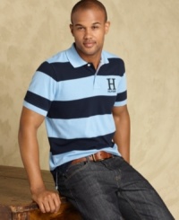 Trim down your summer wardrobe with this slim-fit polo shirt from Tommy Hilfiger. Trim down your summer wardrobe with this slim-fit polo shirt from Tommy Hilfiger.