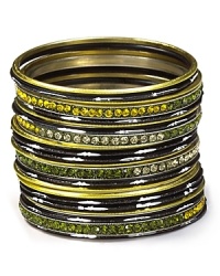 Channel your inner bohemian and flaunt Chamak's bangle set. Wear a few of the textured trinkets or the whole stack for an armload of exotic charm, day to night. Channel your inner bohemian and flaunt Chamak's bangle set. Wear a few of the textured trinkets or the whole stack for an armload of exotic charm, day to night.