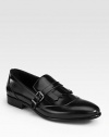 EXCLUSIVELY AT SAKS. Classic loafer with buckle and fringe detail, impeccably crafted in Italy from smooth spazolato leather.Leather upperLeather liningLeather soleMade in Italy