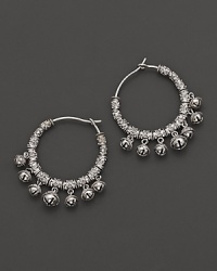 Inspired by Zen philosophy, these hoop earrings from Paul Morelli feature intricately detailed sterling silver meditation bells. Inspired by Zen philosophy, these hoop earrings from Paul Morelli feature intricately detailed sterling silver meditation bells.