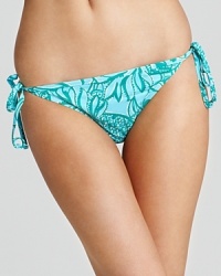 Go (blue) green! The teal hue of this printed bikini from Lilly Pulitzer is universally flattering, while the string ties are ideal for catching rays. Go (blue) green! The teal hue of this printed bikini from Lilly Pulitzer is universally flattering, while the string ties are ideal for catching rays.
