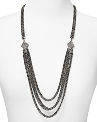 Styled for cool confidence, this Rebecca Minkoff necklace brings the brand's downtown glamour to the jewel box with its rough cut gunmetal chain and splash of glass stones. Styled for cool confidence, this Rebecca Minkoff necklace brings the brand's downtown glamour to the jewel box with its rough cut gunmetal chain and splash of glass stones.