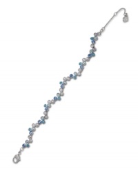 An attractive array of pale blue and clear crystals complement one another on Swarovski's finely crafted bezel bracelet. Set in silver tone mixed metal. Approximate length: 6-1/2 inches.