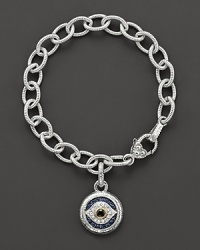 Evil eye charm bracelet with black, white and blue sapphires, gold accents and lobster clasp. Designed by Judith Ripka. Evil eye charm bracelet with black, white and blue sapphires, gold accents and lobster clasp. Designed by Judith Ripka.