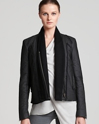 Helmut Lang reinvents the puffer jacket with signature sleek lines and a flattering shawl collar. Helmut Lang reinvents the puffer jacket with signature sleek lines and a flattering shawl collar.