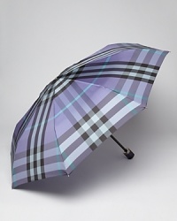 Easily stowed, this classic check umbrella from Burberry boasts endless style in a compact size. Easily stowed, this classic check umbrella from Burberry boasts endless style in a compact size.