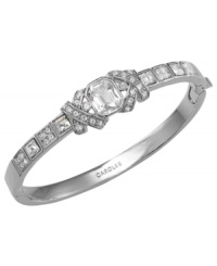 Glistening accents lend eye-catching elegance to this Carolee bracelet. Crafted from imitation rhodium-plated mixed metal, this bridal bangle features shimmering glass accents. Hinged closure. Approximate diameter: 2-3/8 inches by 2-1/4 inches. Glistening accents lend eye-catching elegance to this Carolee bracelet. Crafted from imitation rhodium-plated mixed metal, this bridal bangle features shimmering glass accents. Hinged closure. Approximate diameter: 2-3/8 inches by 2-1/4 inches.