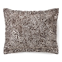 Harkening back to a more primitive time, this tribal tattoo sham livens up any room with a pop of daring print. Harkening back to a more primitive time, this tribal tattoo sham livens up any room with a pop of daring print.