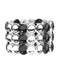 Versatility and shimmer at its best. Monet's trendy three-row style features discs crafted from silver and hematite tone mixed metal. Bracelet stretches to fit wrist. Approximate diameter: 2-1/4 inches. Versatility and shimmer at its best. Monet's trendy three-row style features discs crafted from silver and hematite tone mixed metal. Bracelet stretches to fit wrist. Approximate diameter: 2-1/4 inches.