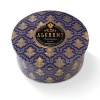 Indulge in the luxurious fragrance of currant and cassis with this fine candle, housed in a metallic tin that's alluringly adorned with a decorative print.
