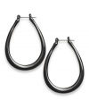 Distinctively designed. Style&co.'s traditional hoop earrings get a modern makeover thanks to their teardrop silhouette. Set in black enamel over silver tone mixed metal, they're sure to stand out as a fashionable favorite in your jewelry collection. Approximate diameter: 1-1/4 inches.