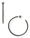 Rock a heavy metal: this pair of simple Juicy Couture hoop earrings styles every outfit edgy, cast in hematite tone plate with bold stone accents.
