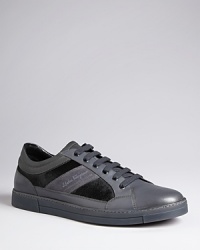 These luxe sneakers from Salvatore Ferragamo headline your casual shoe collection with striking calf hair detail on the sides, an opulent touch from the master of refinement. These luxe sneakers from Salvatore Ferragamo headline your casual shoe collection with striking calf hair detail on the sides, an opulent touch from the master of refinement.