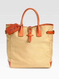 A superior carryall for daily essentials, a polished canvas bag constructed with saddle-inspired leather trim features comfortable rolled handles and interior organizational pocketing for quick access to the necessities.Double top handlesLeather strap with roller-buckle closureInterior slip A superior carryall for daily essentials, a polished canvas bag constructed with saddle-inspired leather trim features comfortable rolled handles and interior organizational pocketing for quick access to the necessities.Double top handlesLeather strap with roller-buckle closureInterior slip