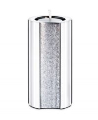 The Ambiray large tea light from Swarovski presents sleek, stainless steel heightened with dozens of tiny faceted clear crystals, creating a home accent that truly radiates glamour and sophistication. The Ambiray large tea light from Swarovski presents sleek, stainless steel heightened with dozens of tiny faceted clear crystals, creating a home accent that truly radiates glamour and sophistication.