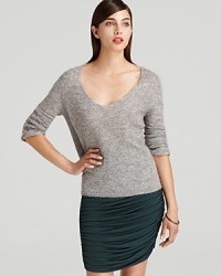 Touting soft tailoring and classic styling, this Halston Heritage sweater slips on for effortless elegance. Touting soft tailoring and classic styling, this Halston Heritage sweater slips on for effortless elegance.