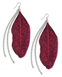Animal instincts. Red feather accents with snake print and chain details combine on silver tone mixed metal ear wire to create an exotic effect. Approximate drop: 4-1/2 inches. Animal instincts. Red feather accents with snake print and chain details combine on silver tone mixed metal ear wire to create an exotic effect. Approximate drop: 4-1/2 inches.