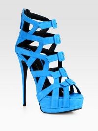 Sexy cutouts define this platform design in buttery suede with a piercing stiletto heel. Self-covered heel, 5¼ (130mm)Covered platform, 1¾ (45mm)Compares to a 4½ heel (115mm)Suede upperFront snap closuresBack zipLeather lining and solePadded insoleMade in Italy Sexy cutouts define this platform design in buttery suede with a piercing stiletto heel. Self-covered heel, 5¼ (130mm)Covered platform, 1¾ (45mm)Compares to a 4½ heel (115mm)Suede upperFront snap closuresBack zipLeather lining and solePadded insoleMade in Italy