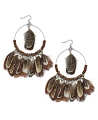 Gypsy inspired. Ali Khan's wood and glass bead earrings (4 mm) combine with brown feathers for an ultra-trendy effect. Set in silver tone mixed metal. Approximate drop: 3-3/4 inches. Approximate diameter: 2 inches. Gypsy inspired. Ali Khan's wood and glass bead earrings (4 mm) combine with brown feathers for an ultra-trendy effect. Set in silver tone mixed metal. Approximate drop: 3-3/4 inches. Approximate diameter: 2 inches.